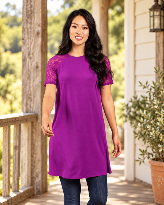 Amethyst raglan dress with visible floral lace sleeves on a rustic porch